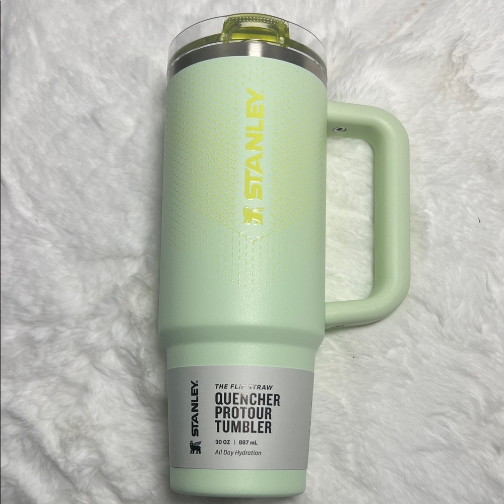 Stanley Mint Green Quencher Tumbler with Yellow Logo and Lid Flip
